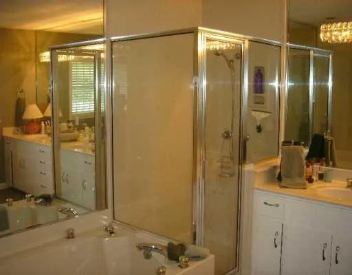 a bathroom with a shower and a sink