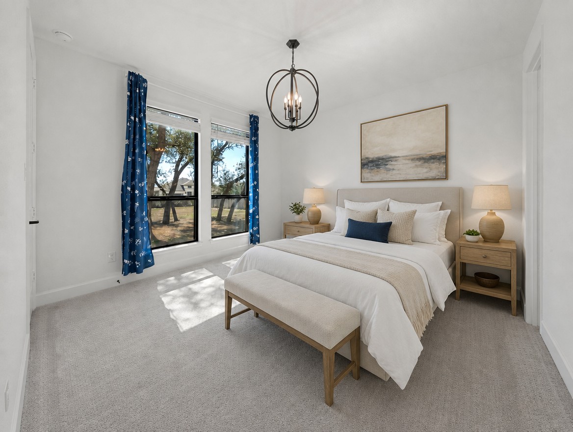 1440 Riva Ridge Drive Leander, TX 78641 - Photo 16 of 37 A well-lit bedroom features ample natural light and a stylish overhead chandelier.