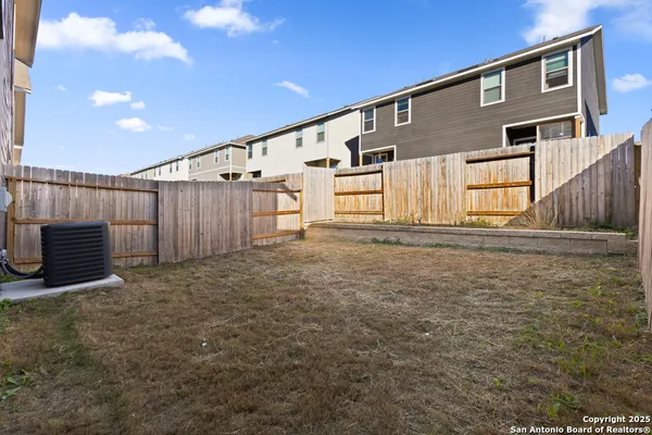 a front view of a house with a fence