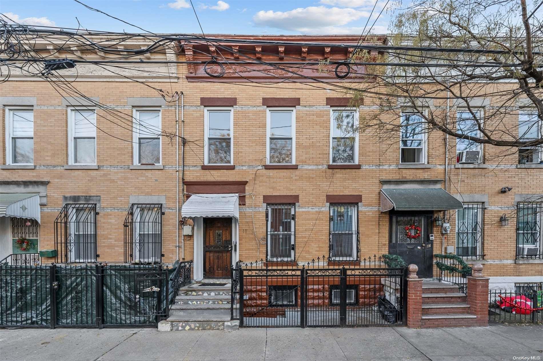 a front view of a building with multiple windows