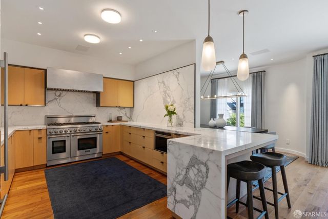 a balcony with table and chairs