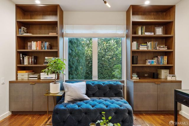 a view of a room with wooden floor