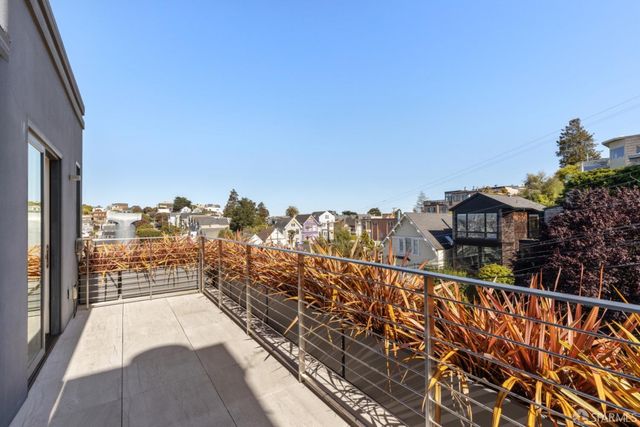 a view of a balcony with an outdoor space