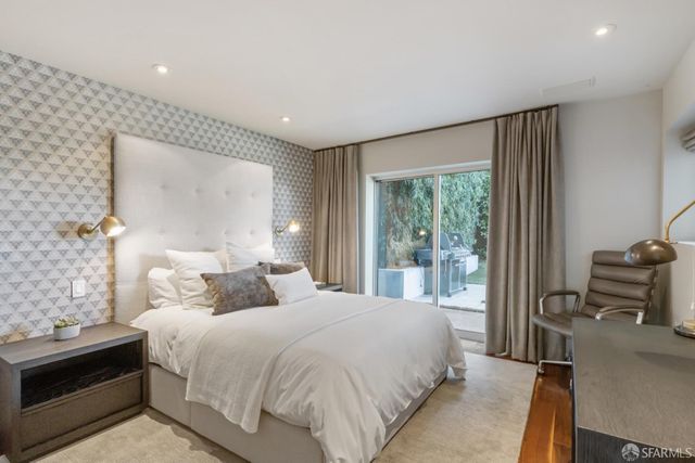 a view of a backyard with plants and trees