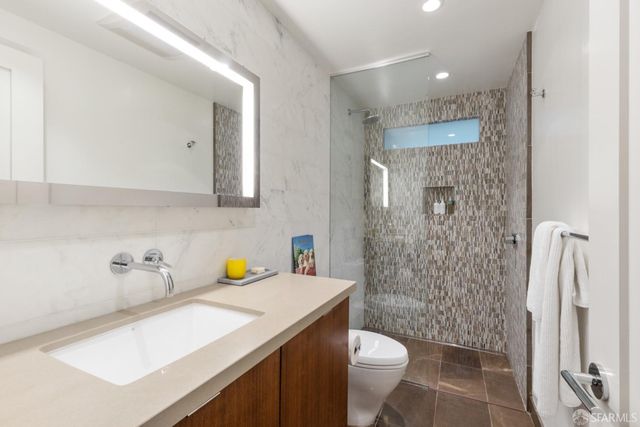 a view of a balcony with furniture