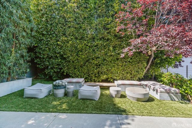 a terrace with couches and a coffee table