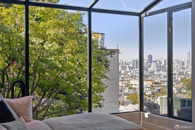 a living room with fireplace furniture and a wooden floor