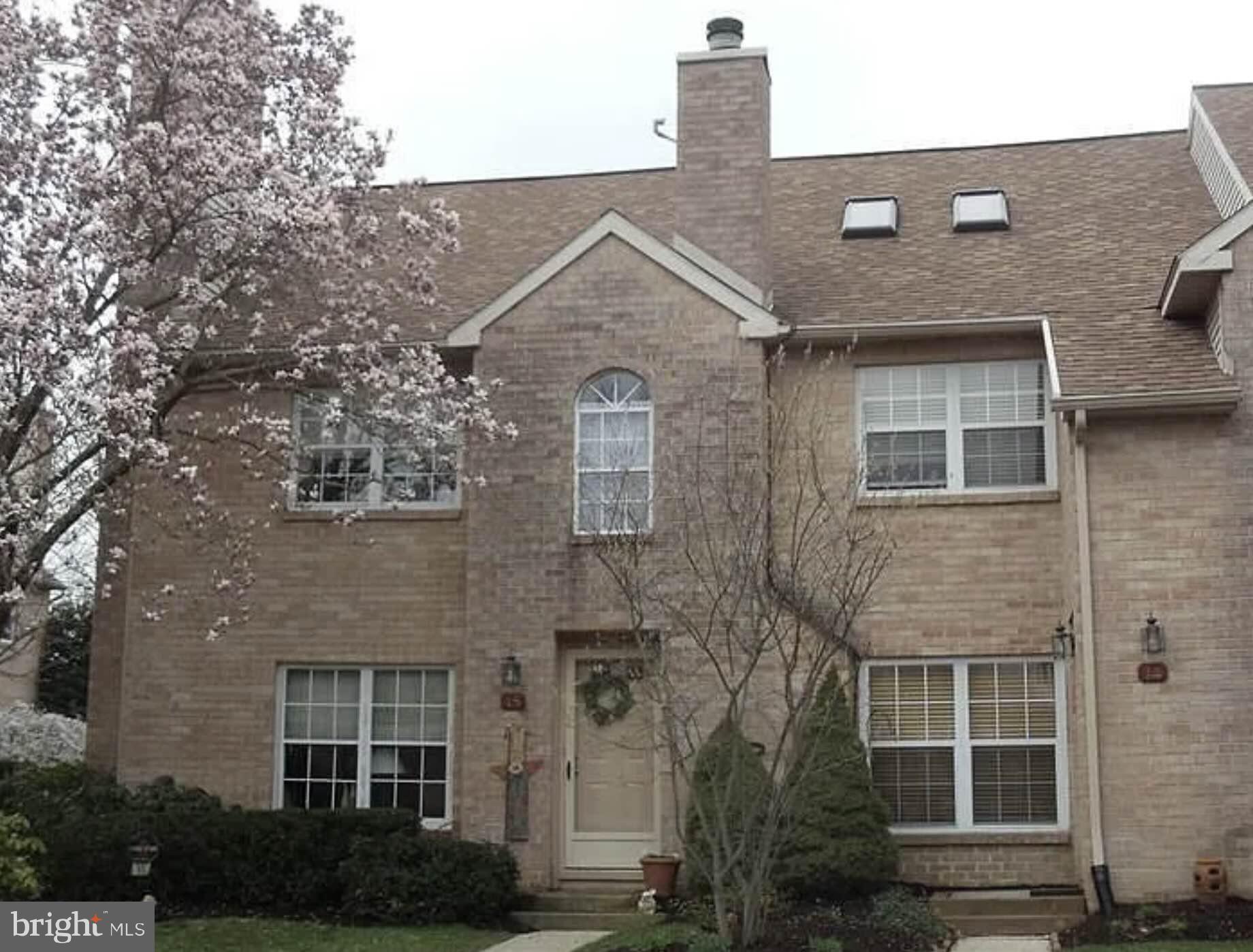 15 Rampart Drive Wayne, PA 19087 - Photo 1 of 11 Charming brick facade with blooming trees.