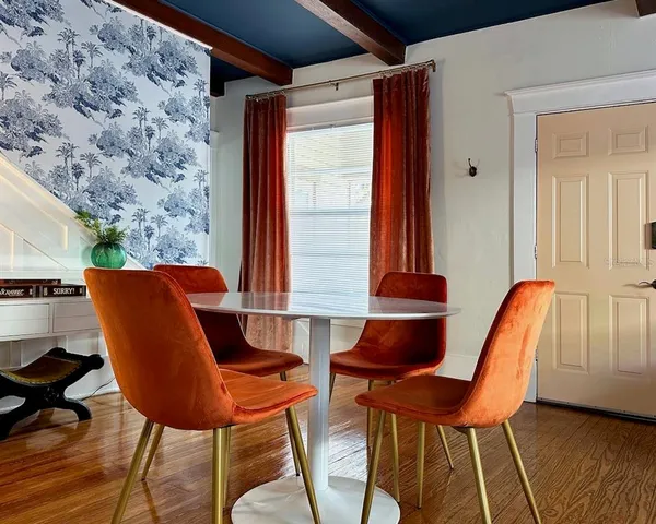 a view of a chair and table in the balcony