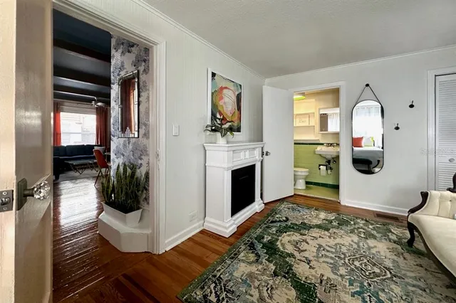 a living room with a couch and a fireplace