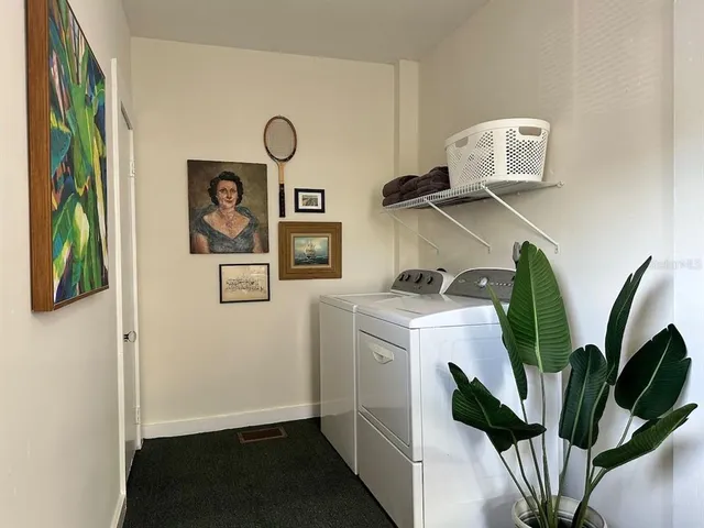 a view of storage and utility room with washer and dryer