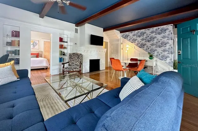 a living room with furniture and a fireplace