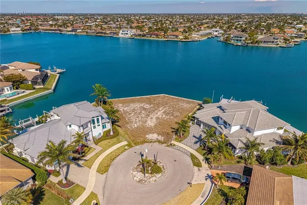 an aerial view of a house with a swimming pool