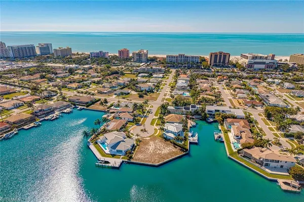 an aerial view of a house with a lake view