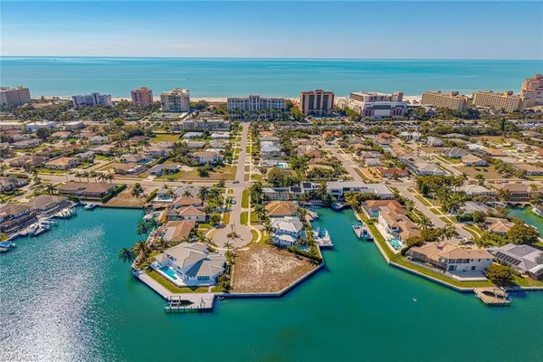 an aerial view of a house with a lake view