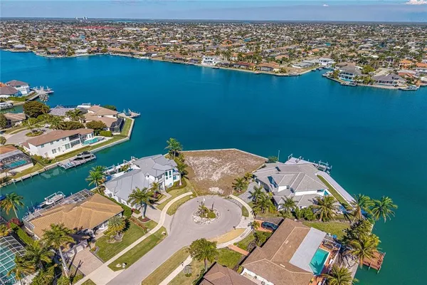 an aerial view of a house with a ocean view
