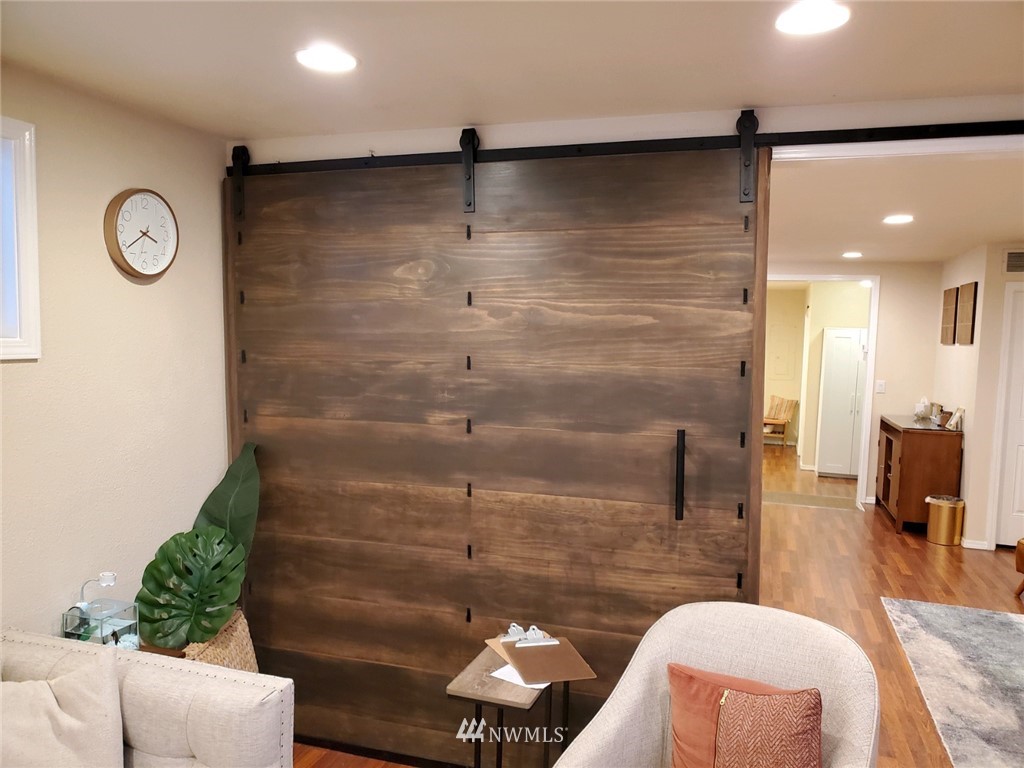 2212 Broadway Everett, WA 98201 - Photo 11 of 26 a bathroom with a granite countertop sink a mirror and shower