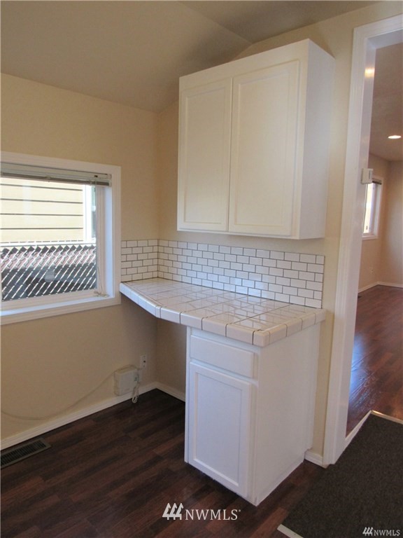 2212 Broadway Everett, WA 98201 - Photo 13 of 26 a view of cabinet with wooden floor