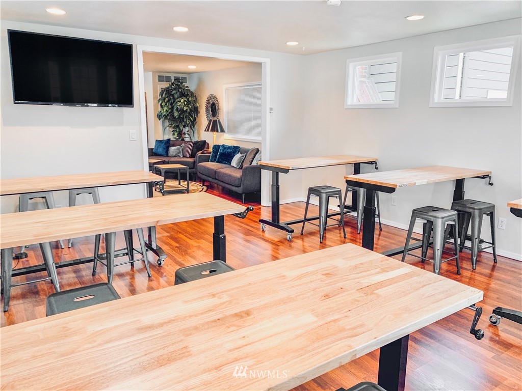 2212 Broadway Everett, WA 98201 - Photo 14 of 26 a dining room with furniture and wooden floor