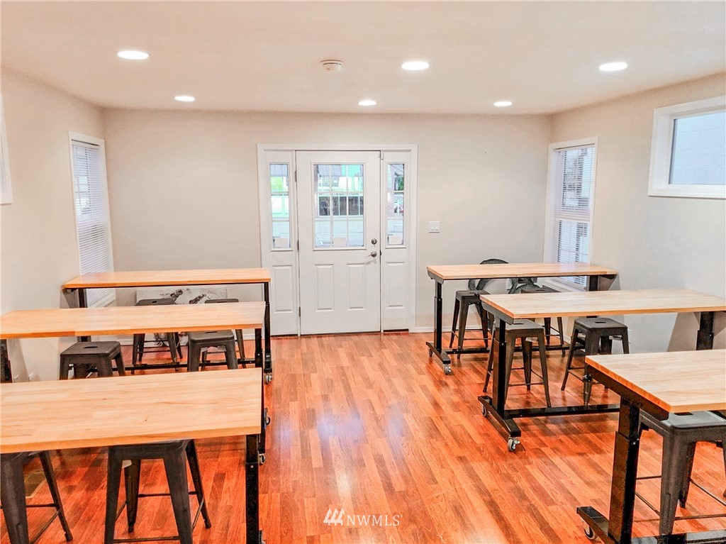 2212 Broadway Everett, WA 98201 - Photo 15 of 26 a living room with stainless steel appliances furniture a dining table and chairs