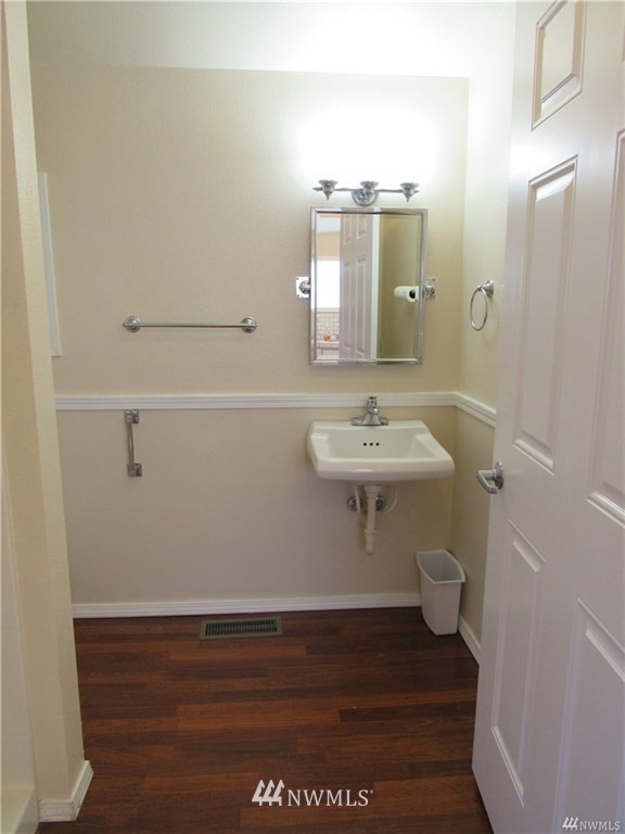 2212 Broadway Everett, WA 98201 - Photo 19 of 26 a bathroom with a sink toilet and vanity