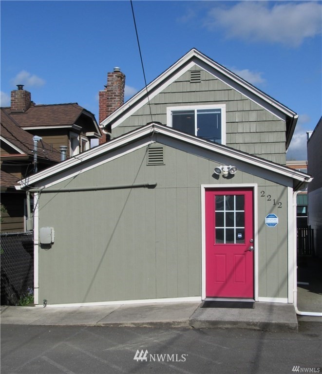 2212 Broadway Everett, WA 98201 - Photo 22 of 26 a view of a house with red door and a garage