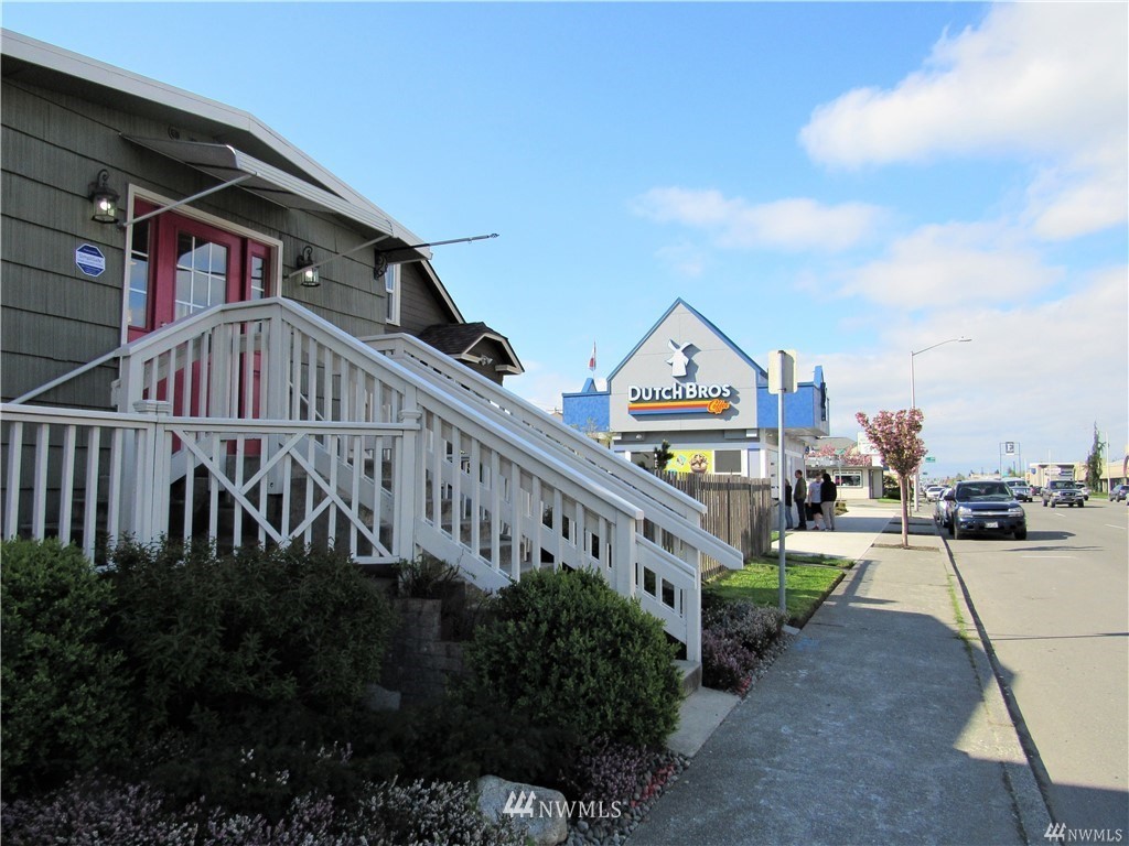 2212 Broadway Everett, WA 98201 - Photo 23 of 26 a view of a house with a yard and plants