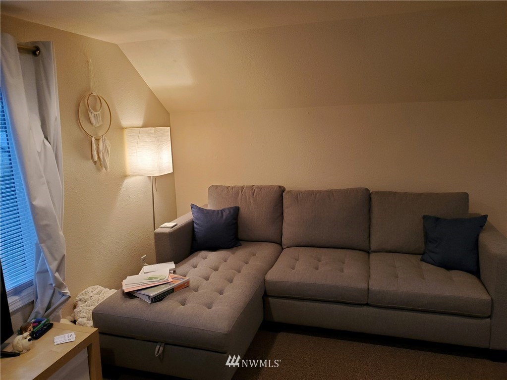 2212 Broadway Everett, WA 98201 - Photo 25 of 26 a living room with a couch and a flat screen tv
