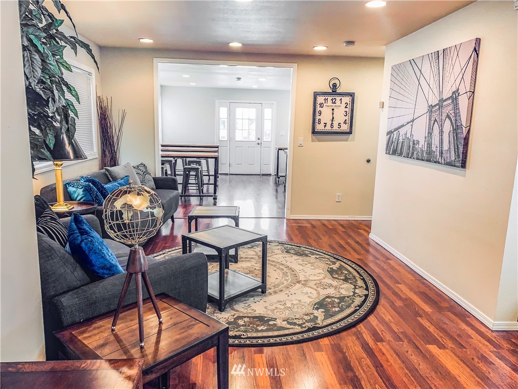 2212 Broadway Everett, WA 98201 - Photo 6 of 26 a view of a livingroom with furniture and wooden floor