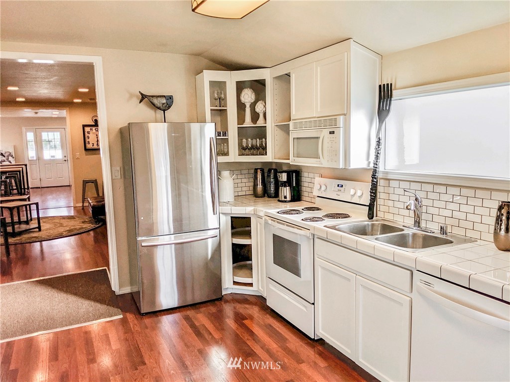 2212 Broadway Everett, WA 98201 - Photo 8 of 26 a kitchen with a refrigerator and a sink