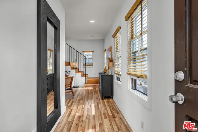a view of a living room with furniture and a window