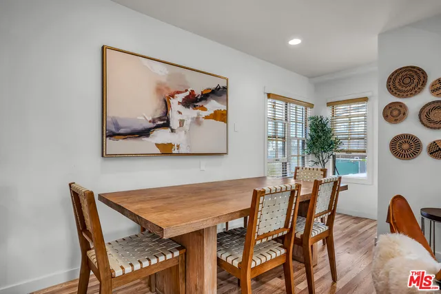 a view of a dining room with furniture and window