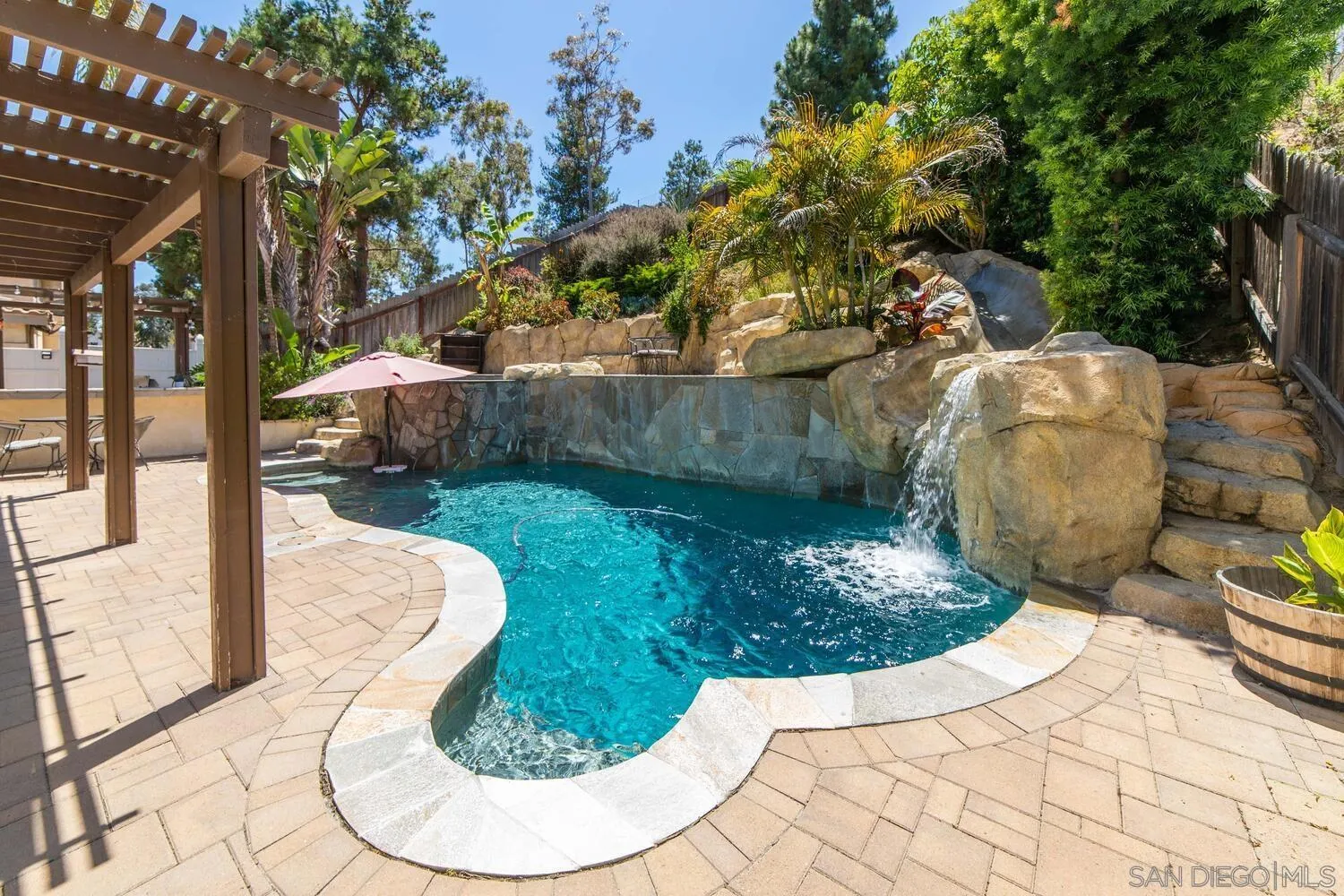 a view of a swimming pool with a patio