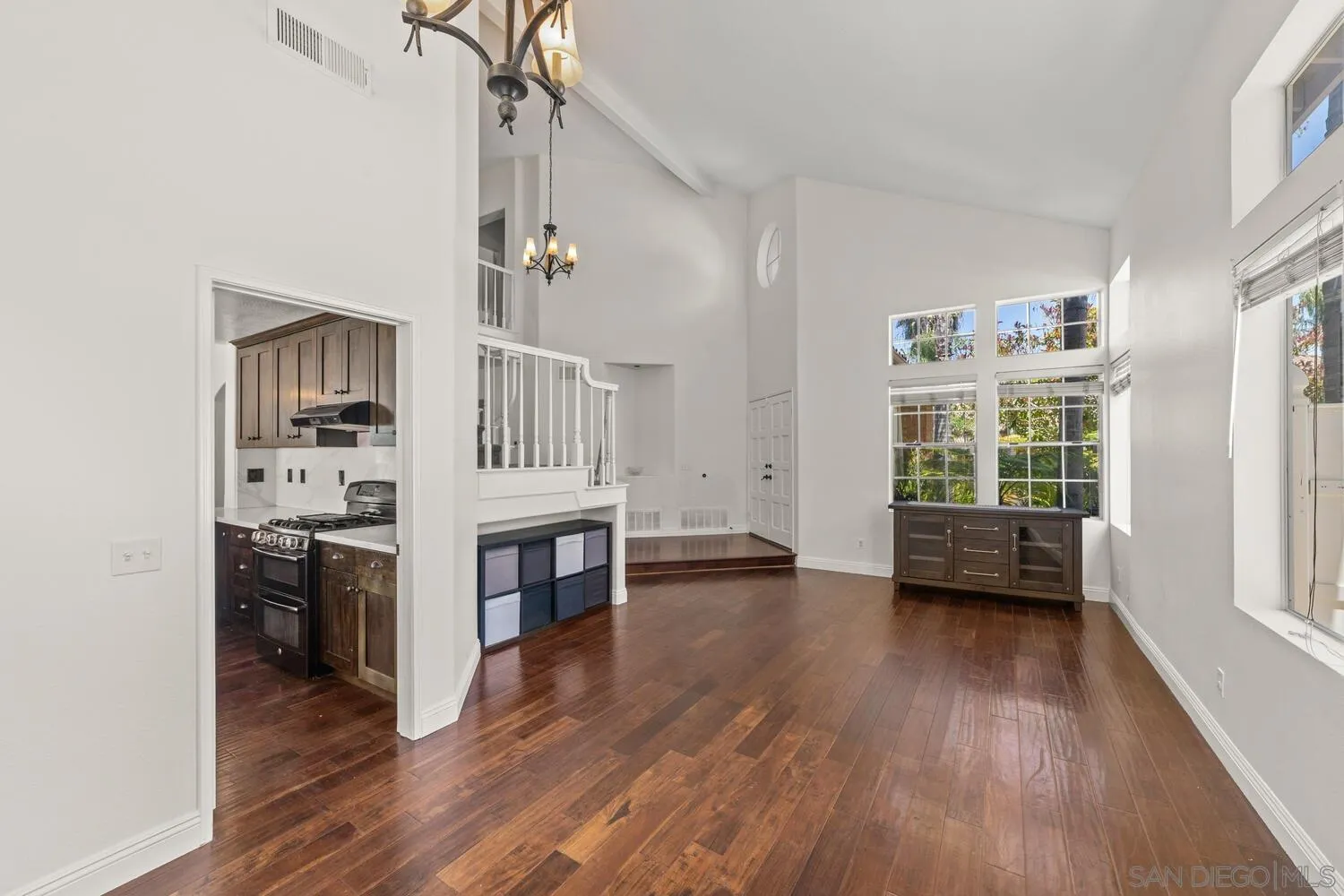 1690 Mountain Pass Circle Vista, CA 92081 - Photo 11 of 46 a view of livingroom with furniture wooden floor window and a kitchen view