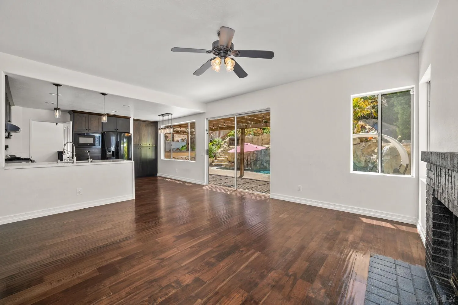 1690 Mountain Pass Circle Vista, CA 92081 - Photo 14 of 46 a view of a living room a window and wooden floor