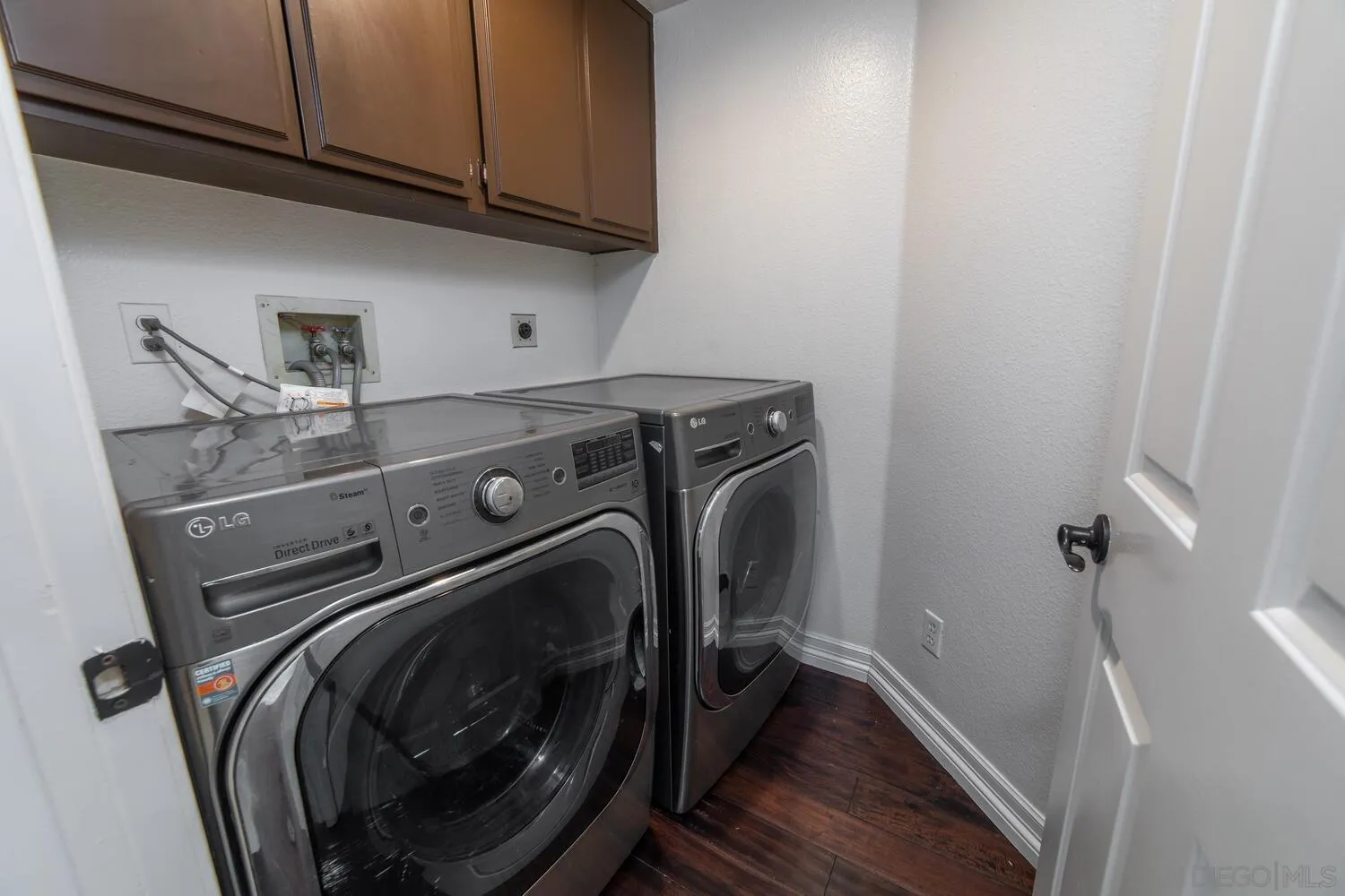 1690 Mountain Pass Circle Vista, CA 92081 - Photo 21 of 46 a utility room with dryer and washer