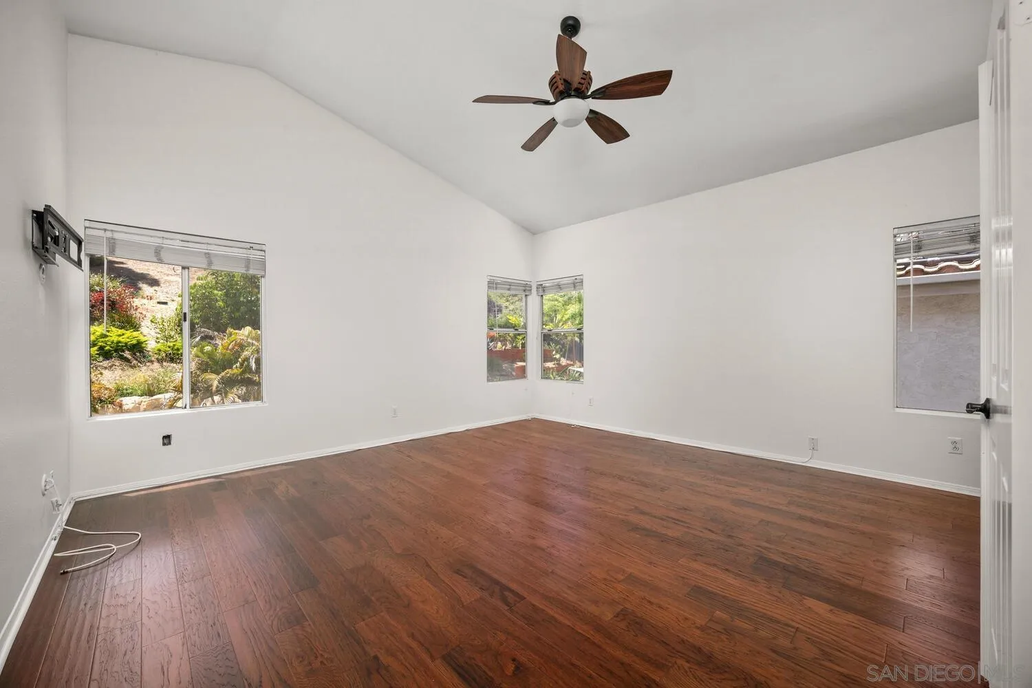 1690 Mountain Pass Circle Vista, CA 92081 - Photo 26 of 46 wooden floor in an empty room with a window