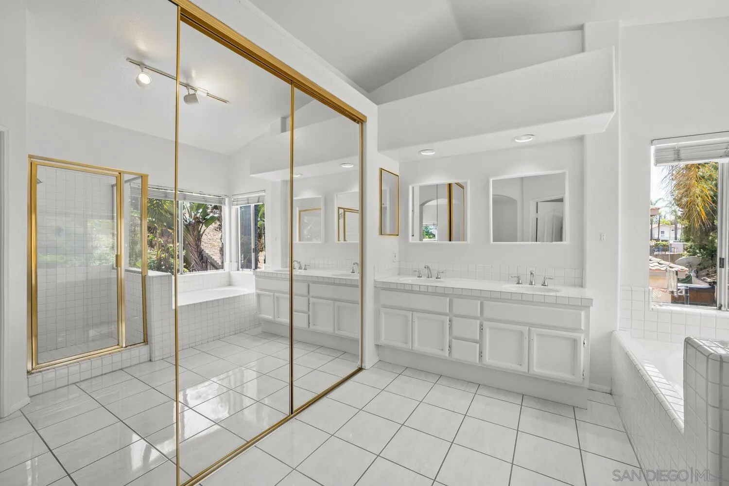 1690 Mountain Pass Circle Vista, CA 92081 - Photo 28 of 46 a spacious bathroom with a shower and a sink