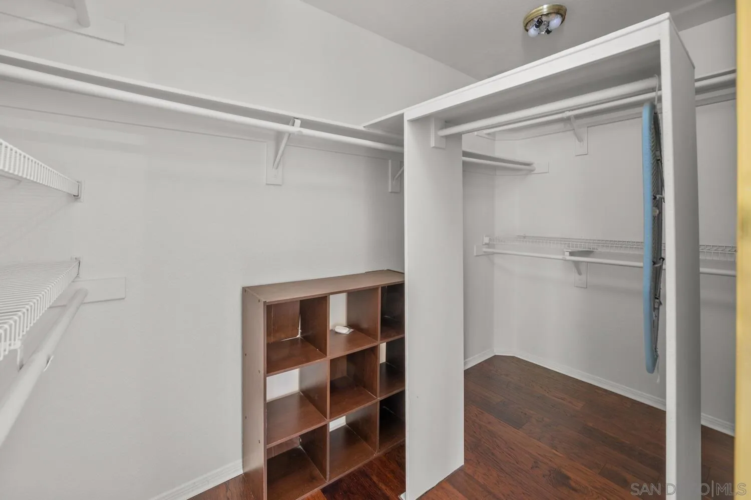 1690 Mountain Pass Circle Vista, CA 92081 - Photo 30 of 46 a view of walk in closet with empty racks
