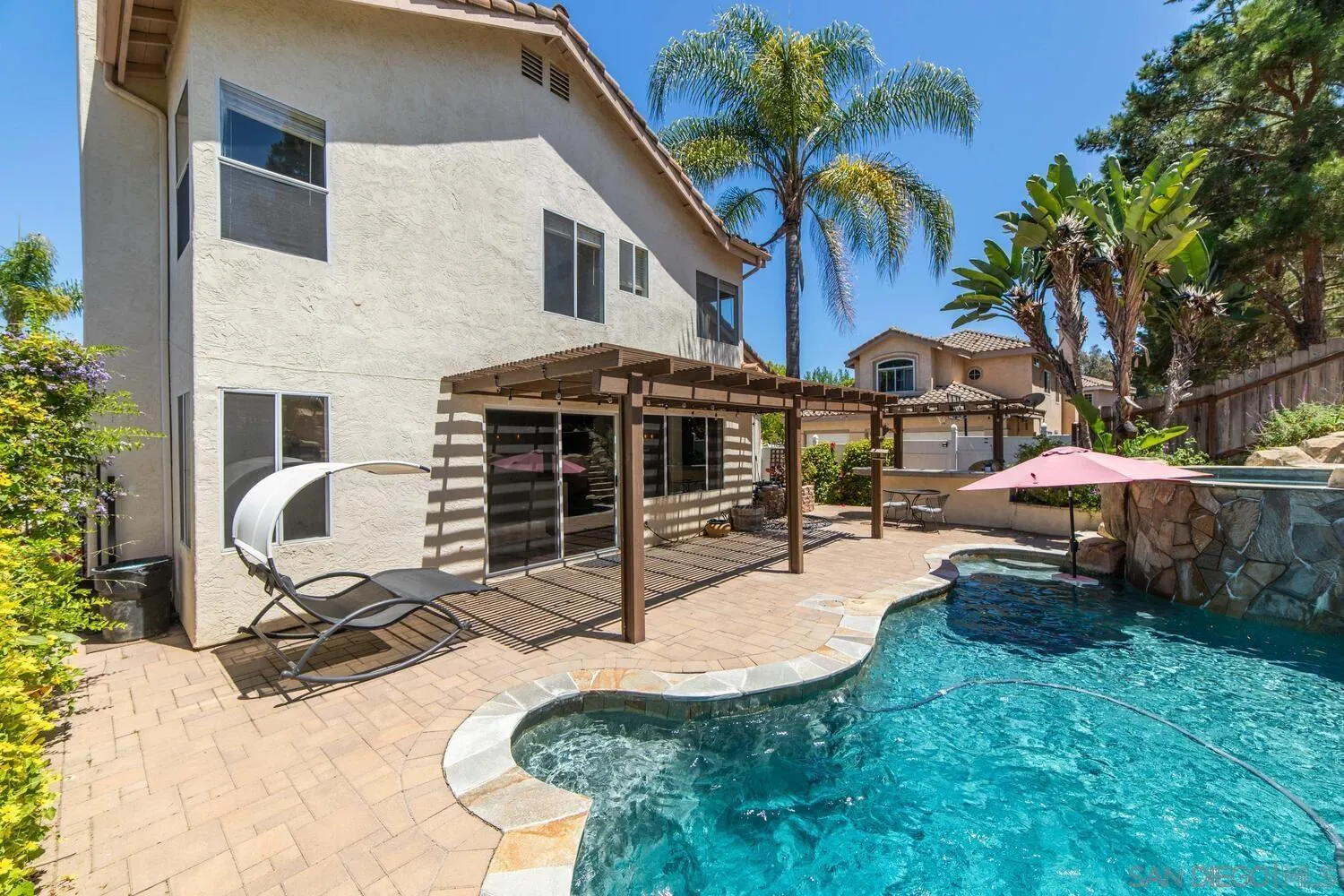 1690 Mountain Pass Circle Vista, CA 92081 - Photo 3 of 46 a view of a house with backyard and sitting area