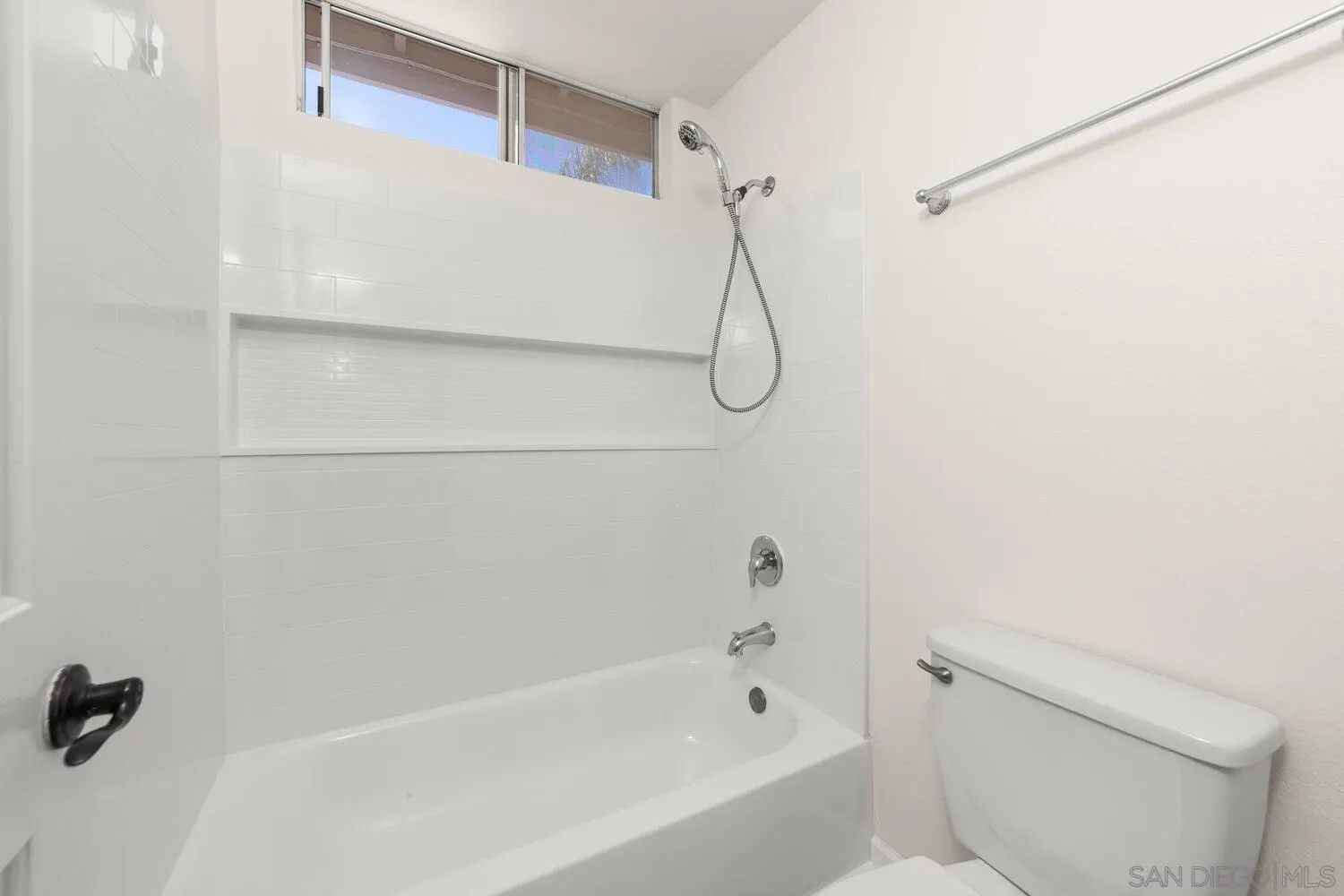 1690 Mountain Pass Circle Vista, CA 92081 - Photo 34 of 46 a bathroom with a shower and a toilet