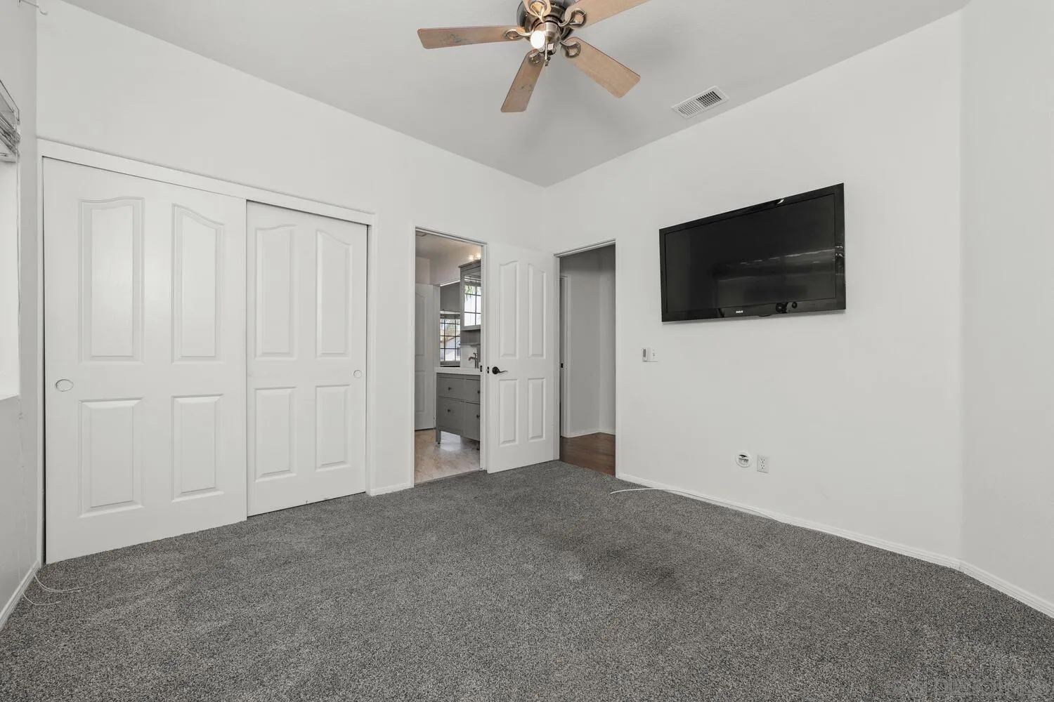 1690 Mountain Pass Circle Vista, CA 92081 - Photo 38 of 46 a view of a livingroom with a flat screen tv