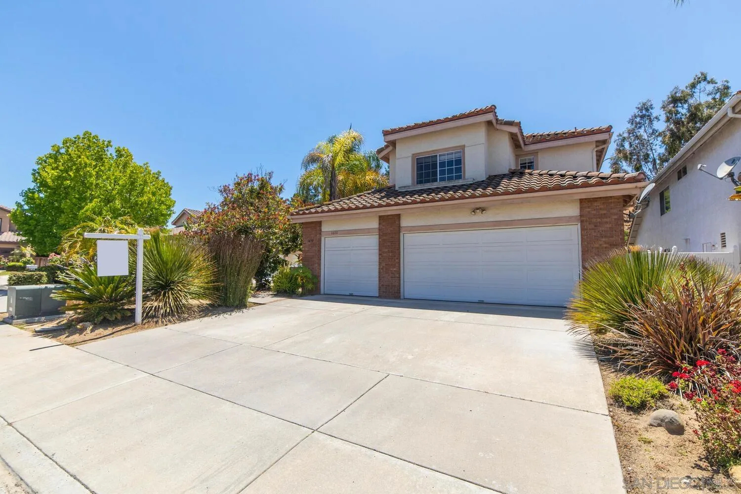 1690 Mountain Pass Circle Vista, CA 92081 - Photo 45 of 46 a front view of a house with a garage