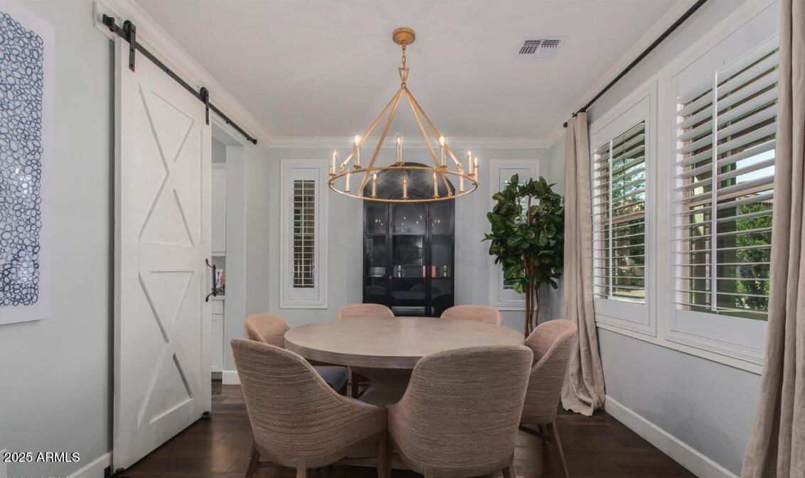 947 West Kaibab Drive Chandler, AZ 85248 - Photo 14 of 32 a view of a dining room with furniture window and wooden floor