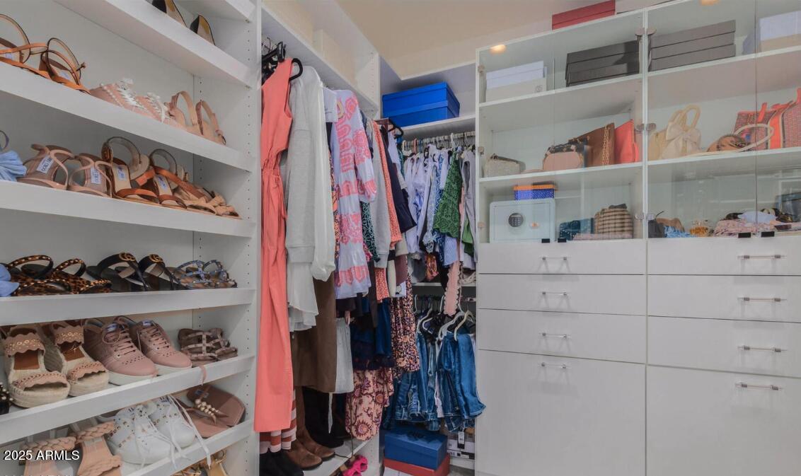 947 West Kaibab Drive Chandler, AZ 85248 - Photo 20 of 32 a view of walk in closet with clothes and shoes