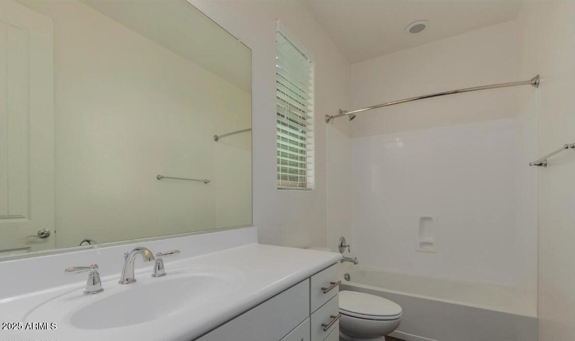 947 West Kaibab Drive Chandler, AZ 85248 - Photo 21 of 32 a bathroom with a sink toilet and vanity