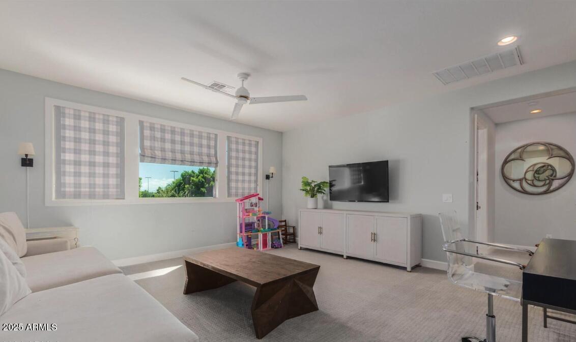 947 West Kaibab Drive Chandler, AZ 85248 - Photo 22 of 32 a living room with furniture and a flat screen tv