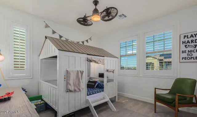 a view of a room with a table and chairs