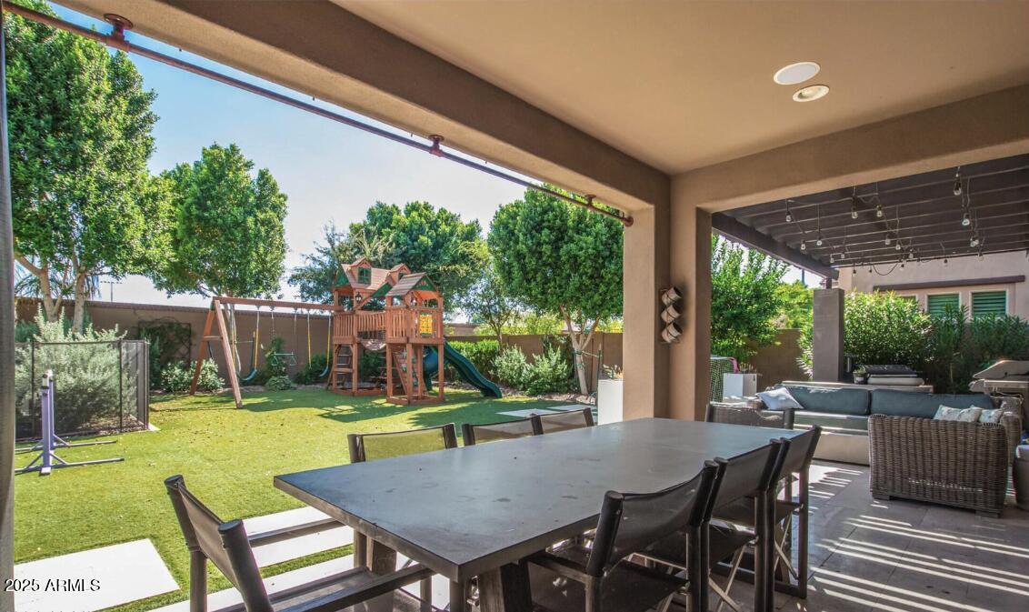 947 West Kaibab Drive Chandler, AZ 85248 - Photo 4 of 32 a view of a patio with a table chairs and a backyard