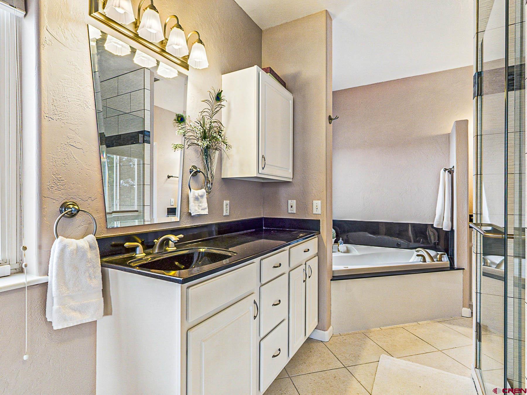 12689 6100th Road Montrose, CO 81403 - Photo 23 of 45 a kitchen with a stove and a refrigerator